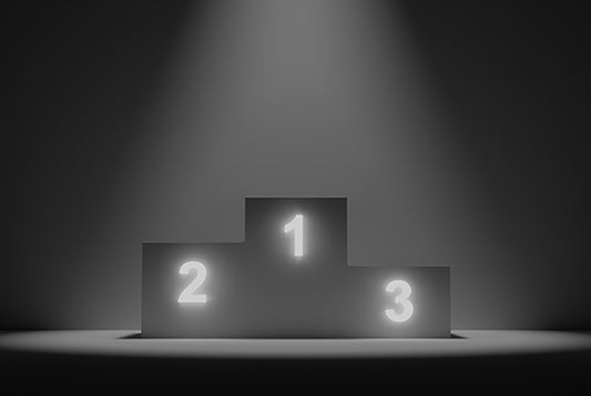 Lit-up (neon) winners' podium with numbers "1" "2" and "3" 